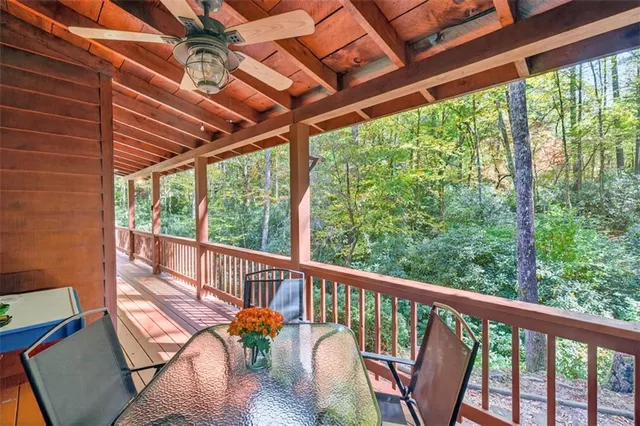 a view of a patio with wooden floor