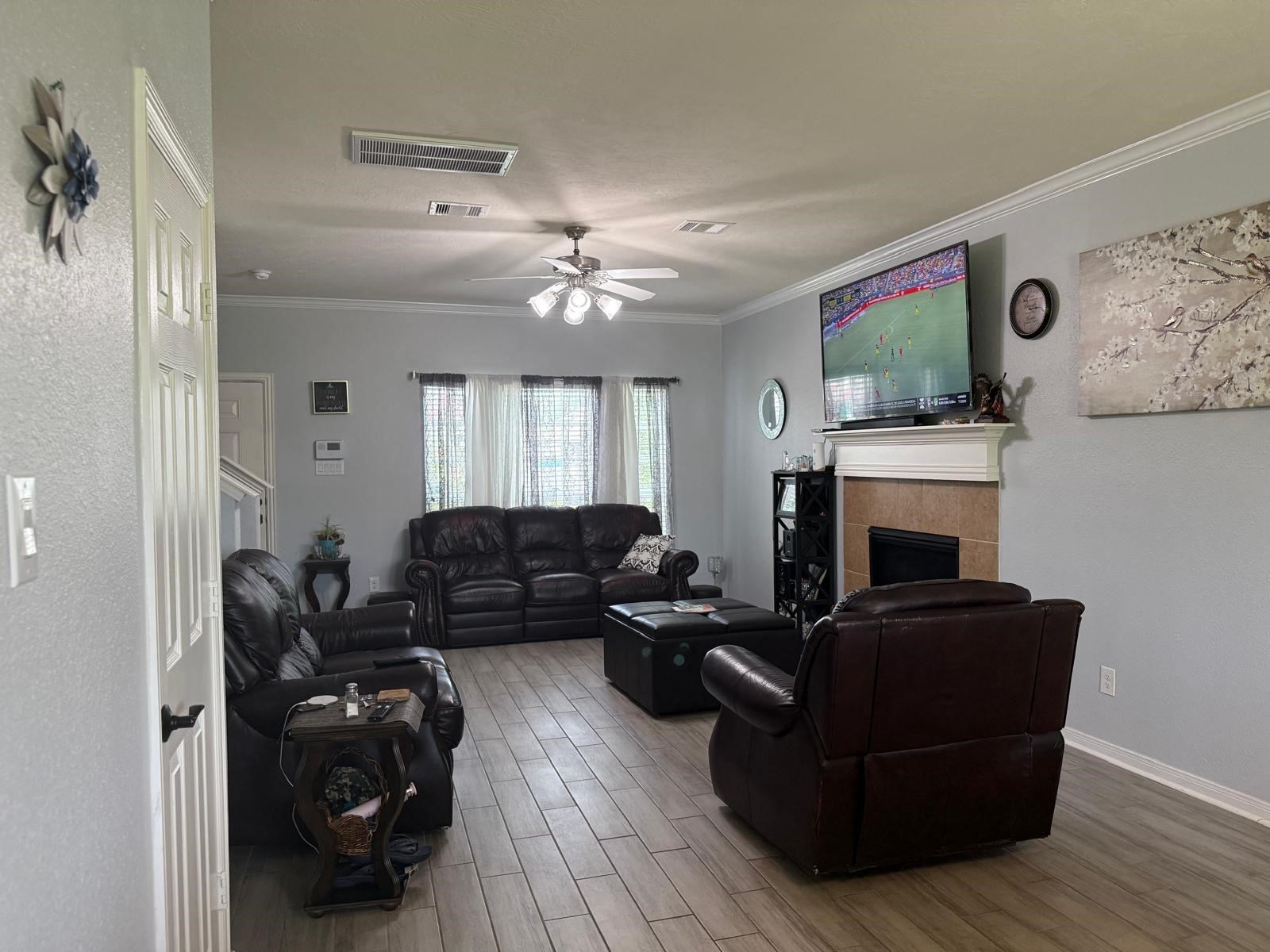 22730 Sunset Glen Lane Spring, TX 77373 - Photo 2 of 7 a living room with furniture and a fireplace