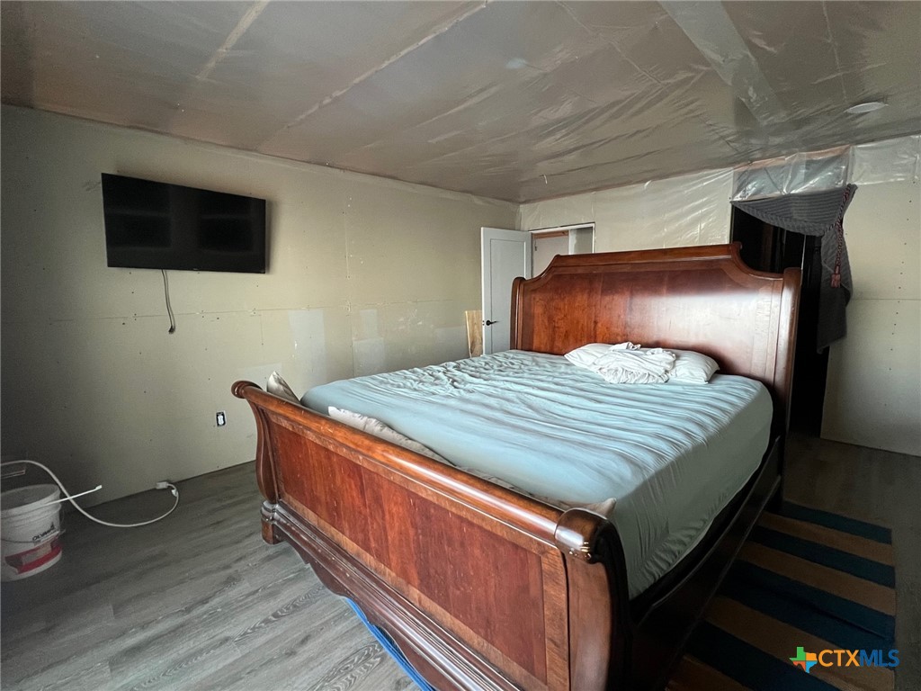 9 Lee Street Port Lavaca, TX 77979 - Photo 5 of 11 a bedroom with a bed and a flat screen tv