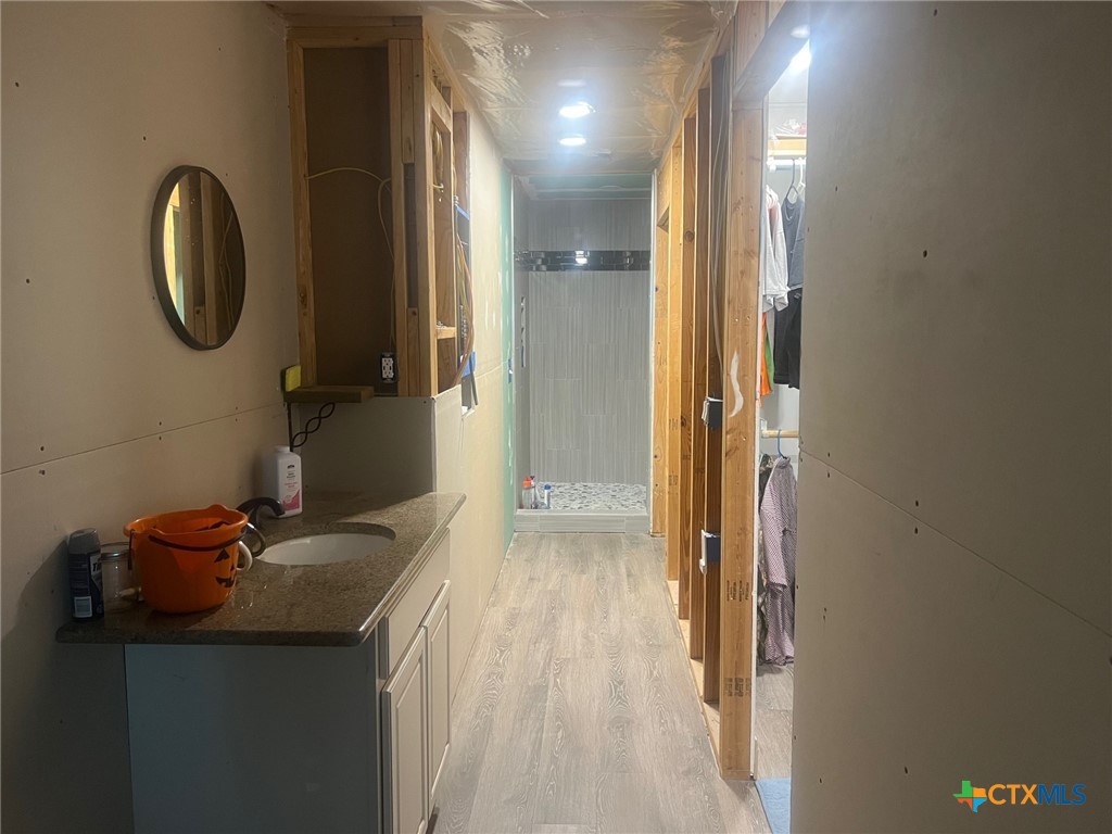 9 Lee Street Port Lavaca, TX 77979 - Photo 8 of 11 a bathroom with a sink and a mirror