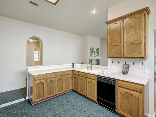 a spacious bathroom with a sink double vanity and a mirror