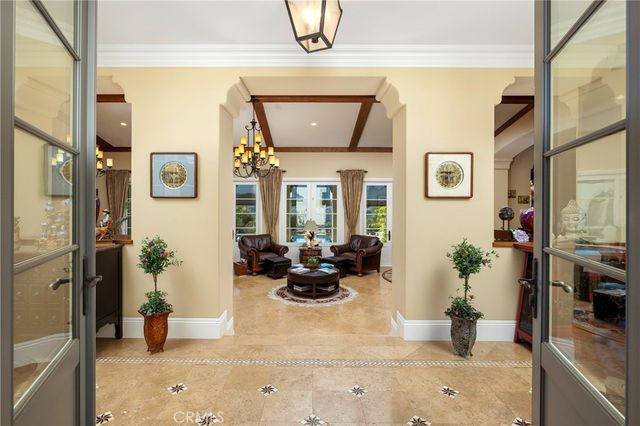 a living room with furniture and potted plant