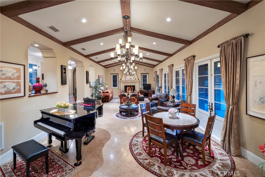 47 Vernal Irvine, CA 92603 - Photo 14 of 38 a living room with furniture a chandelier and a rug
