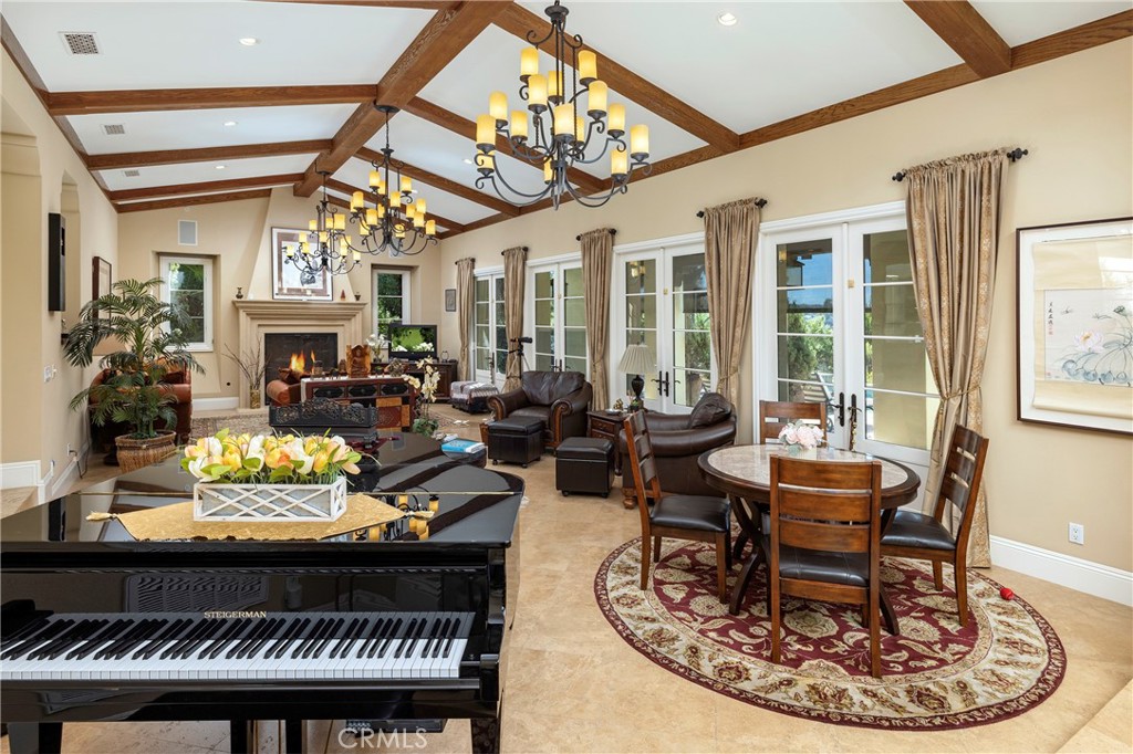 47 Vernal Irvine, CA 92603 - Photo 16 of 38 a living room with furniture a chandelier and a rug