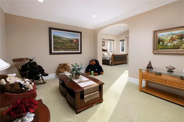 a living room with furniture a couch and dresser