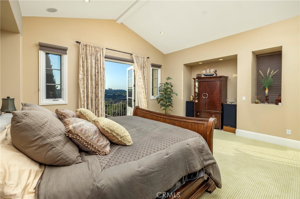 47 Vernal Irvine, CA 92603 - Photo 27 of 38 a bedroom with a bed and a large mirror