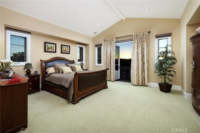 a bedroom with a bed and a couch