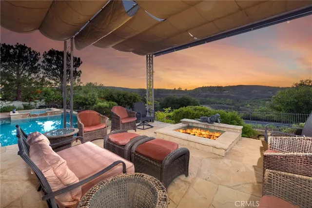 a view of a lake with couches chairs