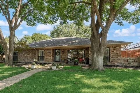 a front view of house with yard and outdoor seating