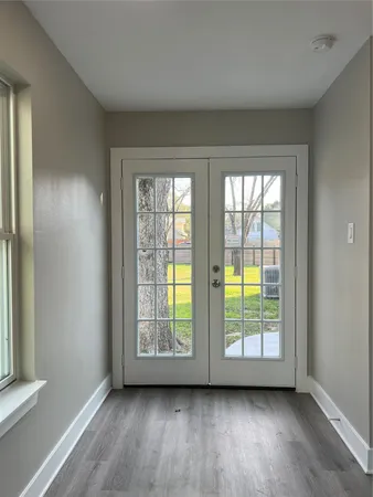 a kitchen with granite countertop wooden cabinets and white appliances