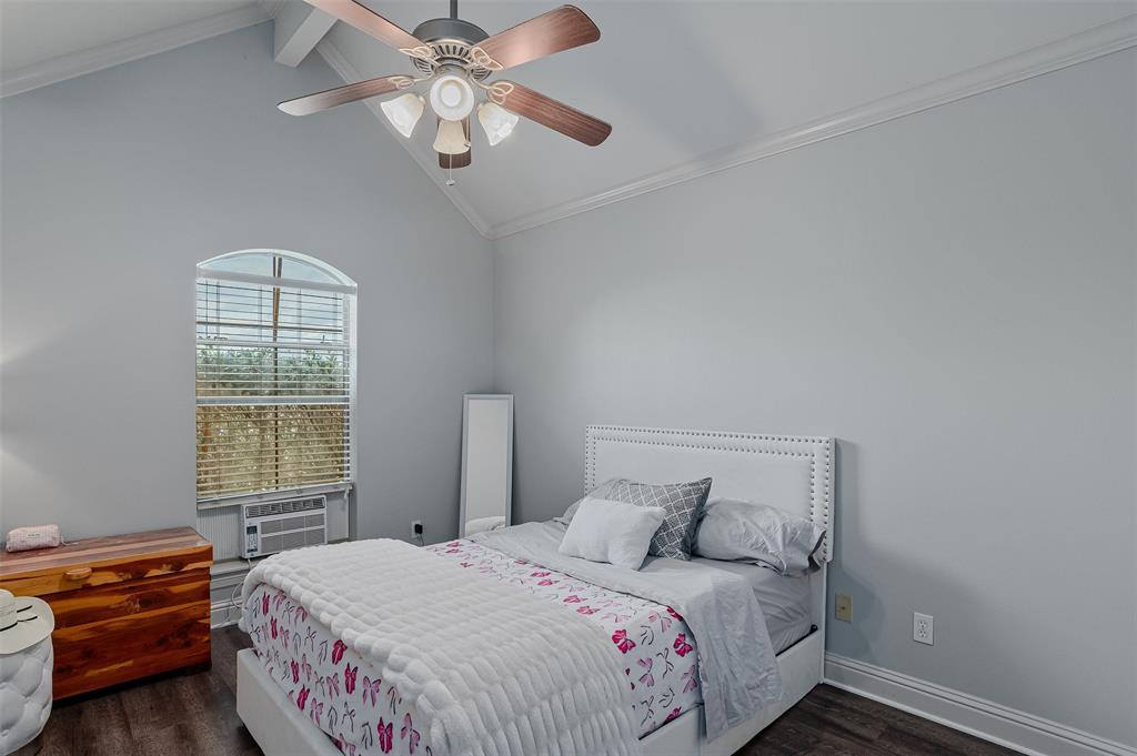 102 Fitzwilliam Street Haughton, LA 71037 - Photo 16 of 18 a bedroom with a bed and a chandelier