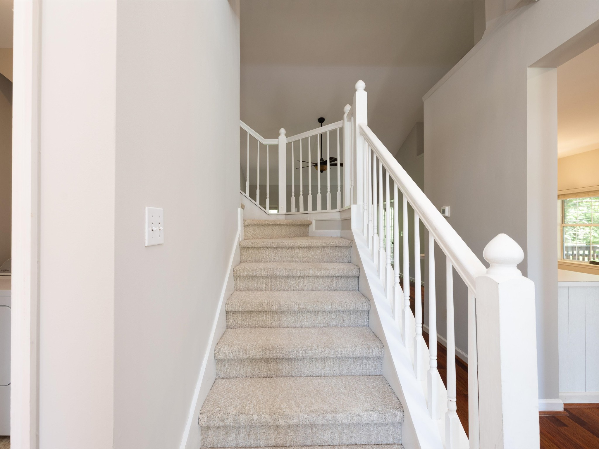 4629 Sandy Creek Road Nashville, TN 37221 - Photo 21 of 48 a view of staircase with lots of frames on wall and a window