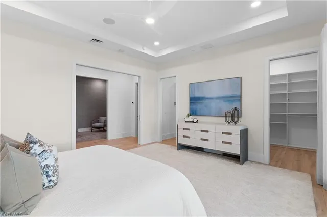 a bedroom with furniture and flat screen tv