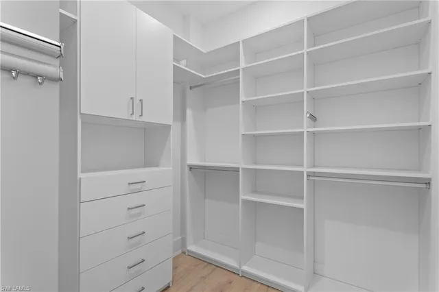 a view of an empty walk in closet