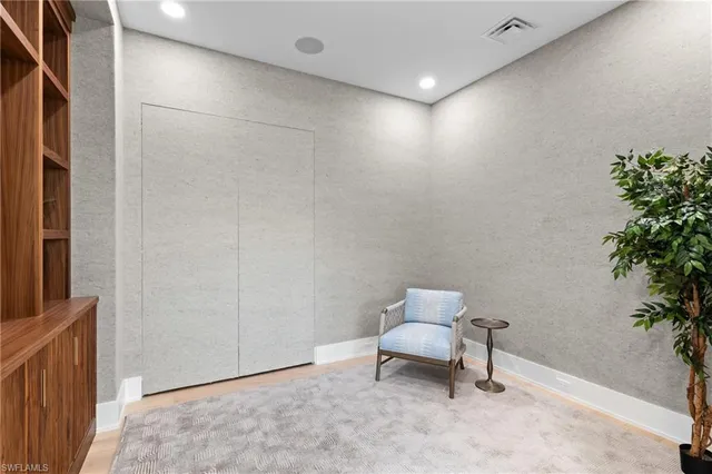 a room with furniture and a potted plant