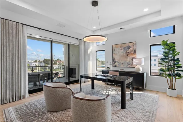 a view of a dining room with furniture window and wooden floor