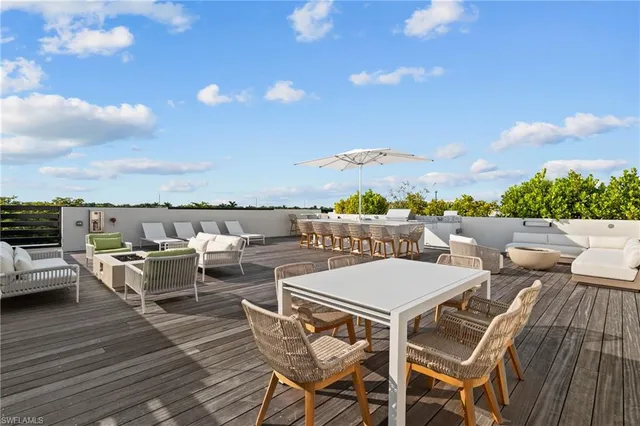 a view of a terrace with furniture and stove