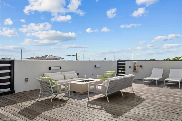 a view of a terrace with furniture and stove