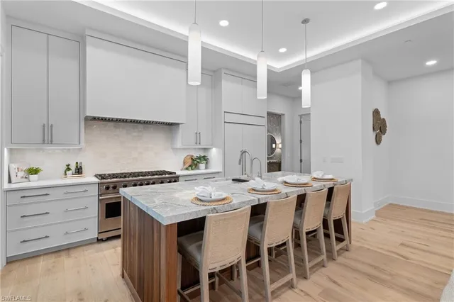 a kitchen with a table and chairs in it