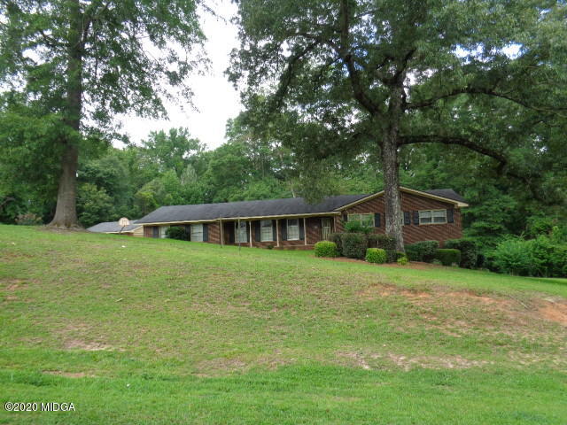 5539 Bankston Lake Road Macon, GA 31216 - Photo 1 of 29 a front view of a house with a garden