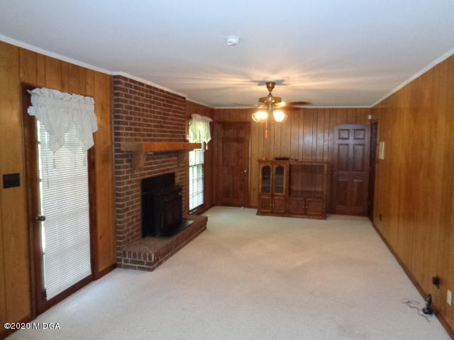 5539 Bankston Lake Road Macon, GA 31216 - Photo 14 of 29 a view of an empty room with a fireplace