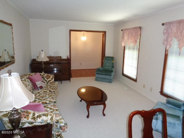 5539 Bankston Lake Road Macon, GA 31216 - Photo 17 of 29 a living room with furniture and a mirror