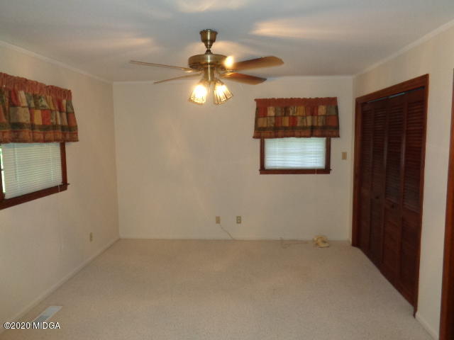 5539 Bankston Lake Road Macon, GA 31216 - Photo 20 of 29 an empty room with a window and a fan