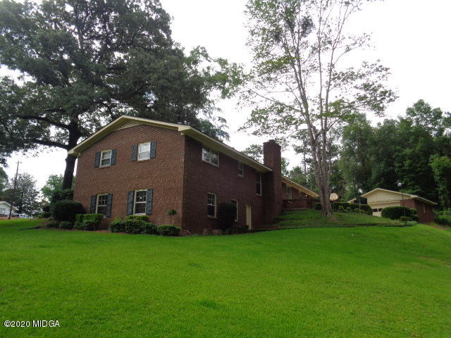 5539 Bankston Lake Road Macon, GA 31216 - Photo 3 of 29 a house with garden in front of it