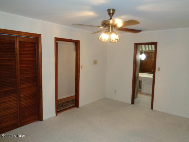 5539 Bankston Lake Road Macon, GA 31216 - Photo 21 of 29 wooden floor in an empty room with a window
