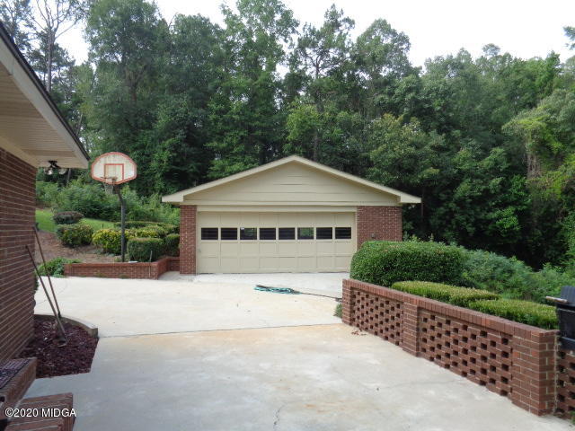 5539 Bankston Lake Road Macon, GA 31216 - Photo 6 of 29 a house with trees in the background
