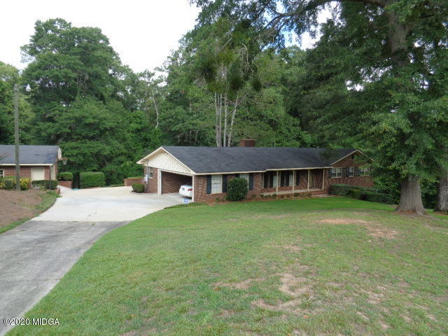 5539 Bankston Lake Road Macon, GA 31216 - Photo 8 of 29 a view of a house with a big yard plants and large trees
