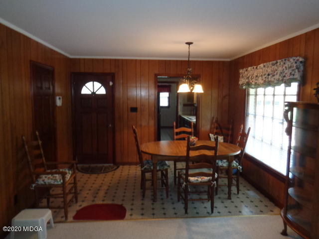 5539 Bankston Lake Road Macon, GA 31216 - Photo 9 of 29 a view of a dining room with furniture and chandelier