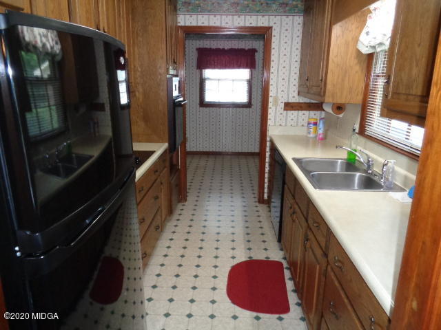 5539 Bankston Lake Road Macon, GA 31216 - Photo 10 of 29 a bathroom with a sink a toilet a mirror and shower