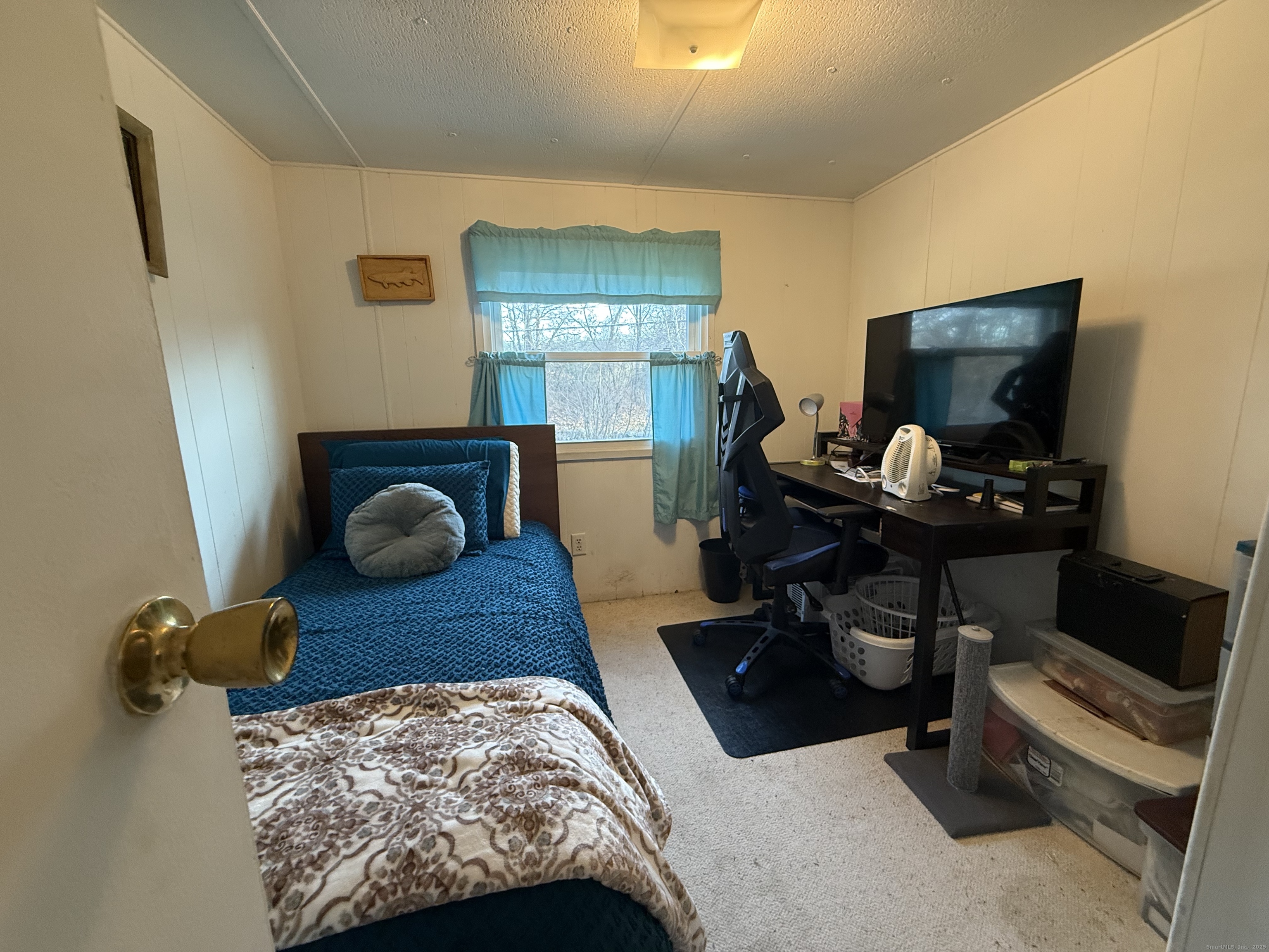 4 Sunshine Terrace Thompson, CT 06255 - Photo 18 of 25 a living room with furniture and a flat screen tv