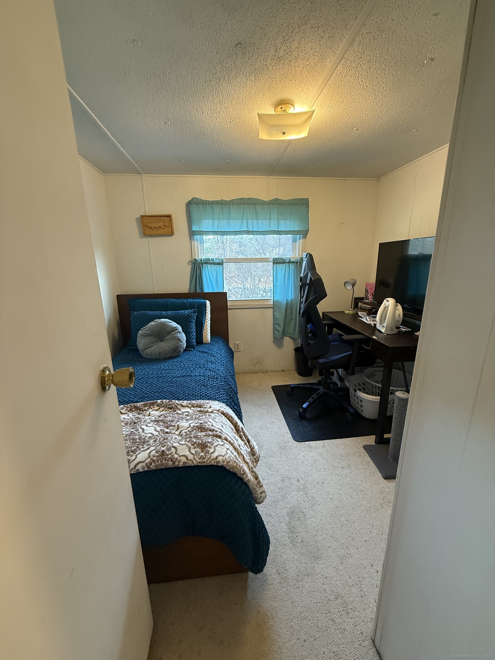 4 Sunshine Terrace Thompson, CT 06255 - Photo 19 of 25 a bedroom with a bed and a window