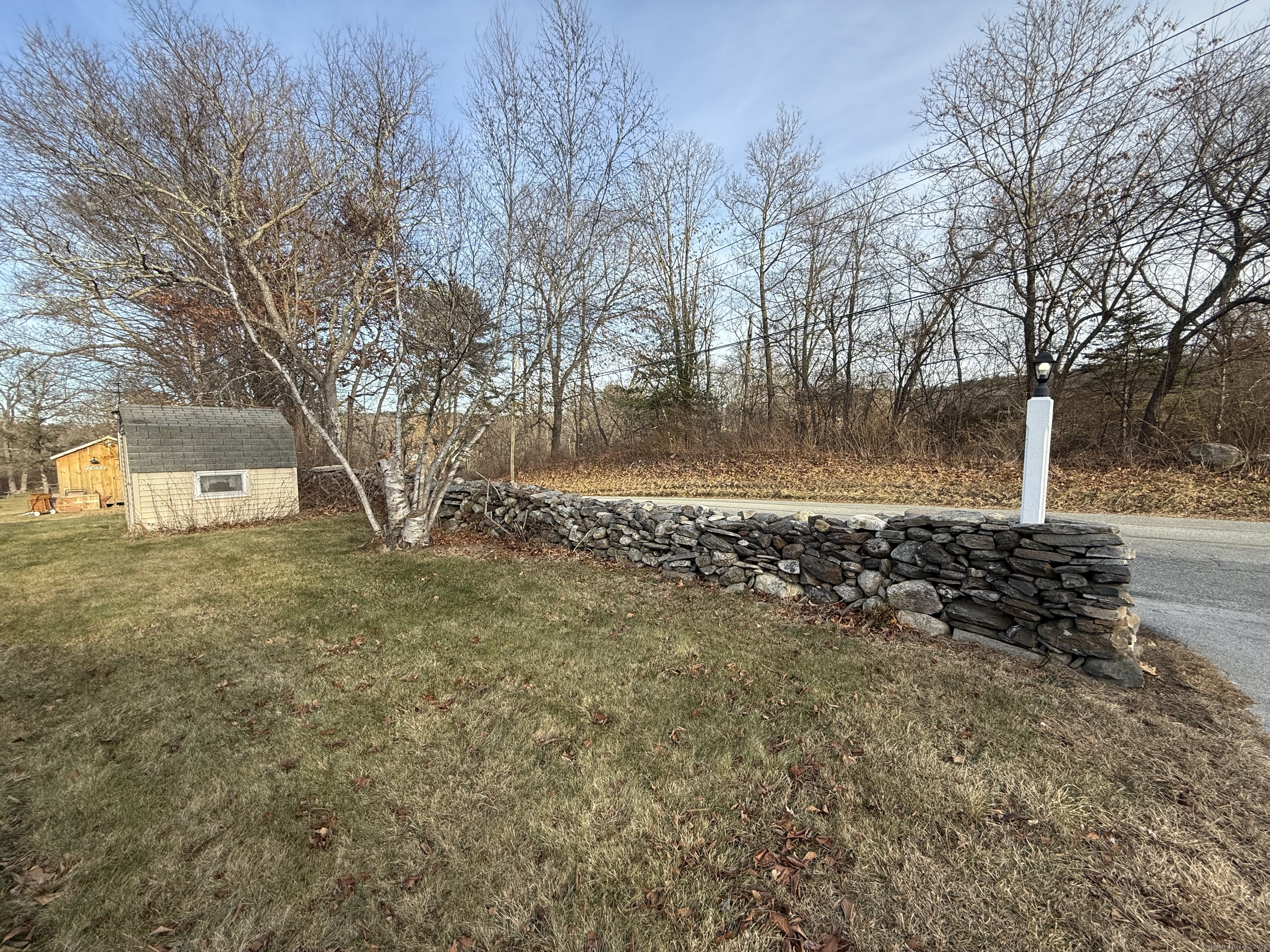 4 Sunshine Terrace Thompson, CT 06255 - Photo 24 of 25 a view of a yard with plants and trees