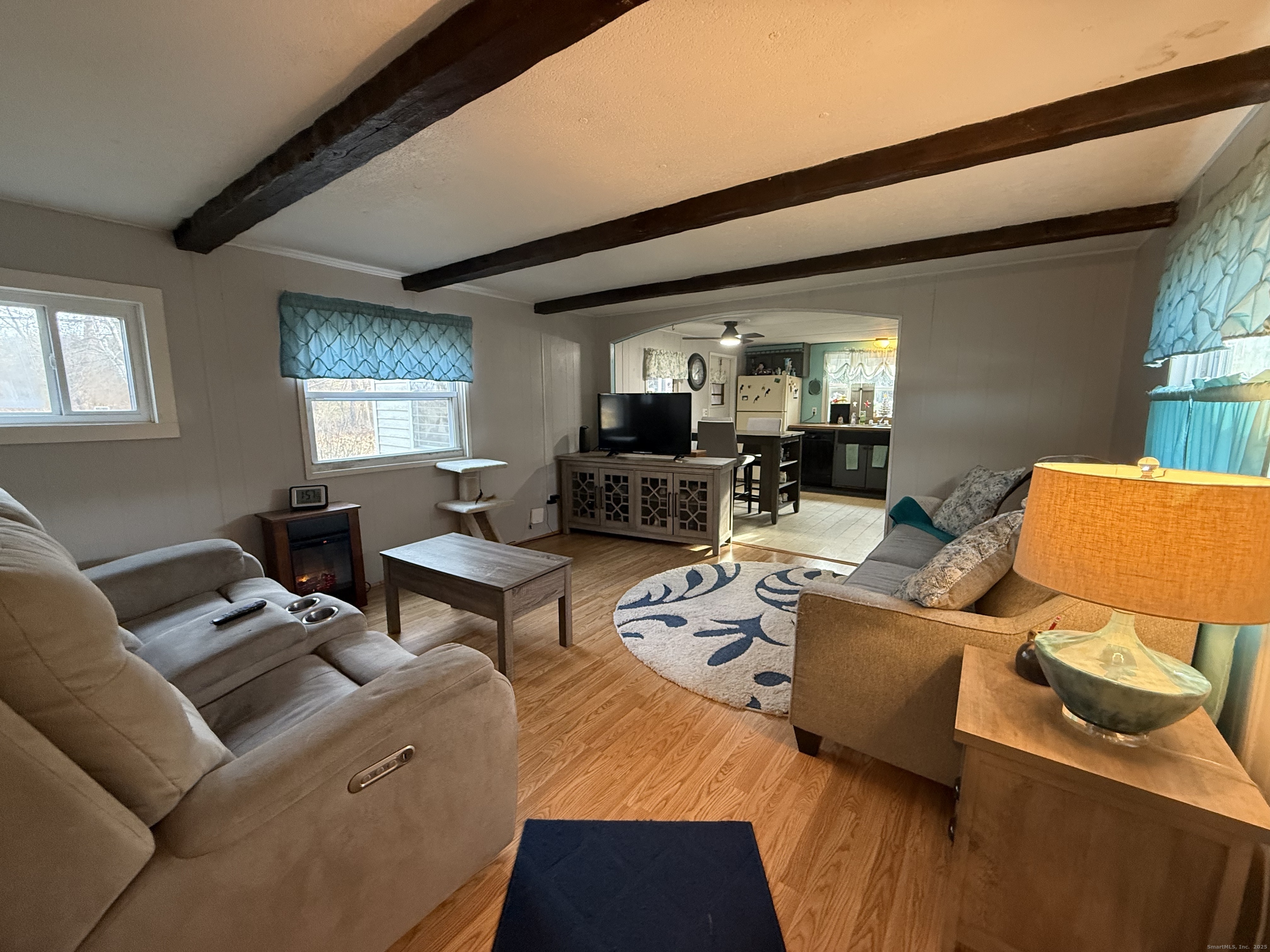 4 Sunshine Terrace Thompson, CT 06255 - Photo 6 of 25 a living room with furniture and a flat screen tv