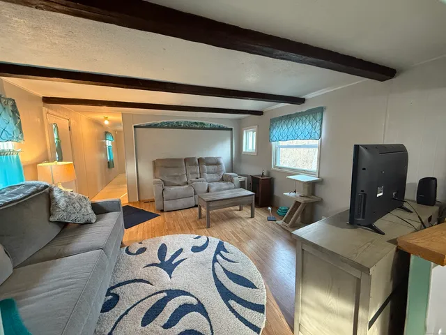 a living room with furniture and a large window