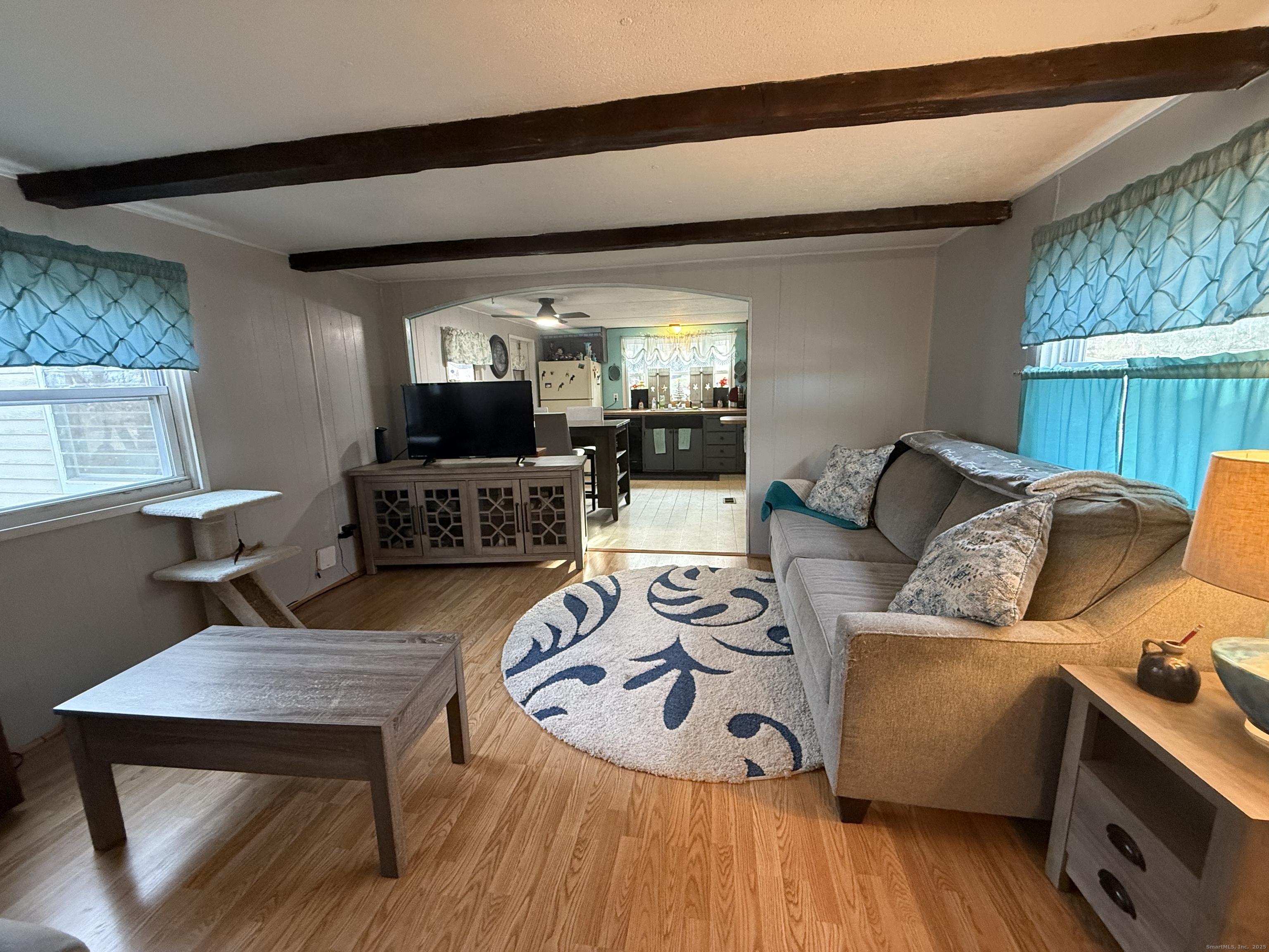 4 Sunshine Terrace Thompson, CT 06255 - Photo 8 of 25 a living room with furniture and a flat screen tv