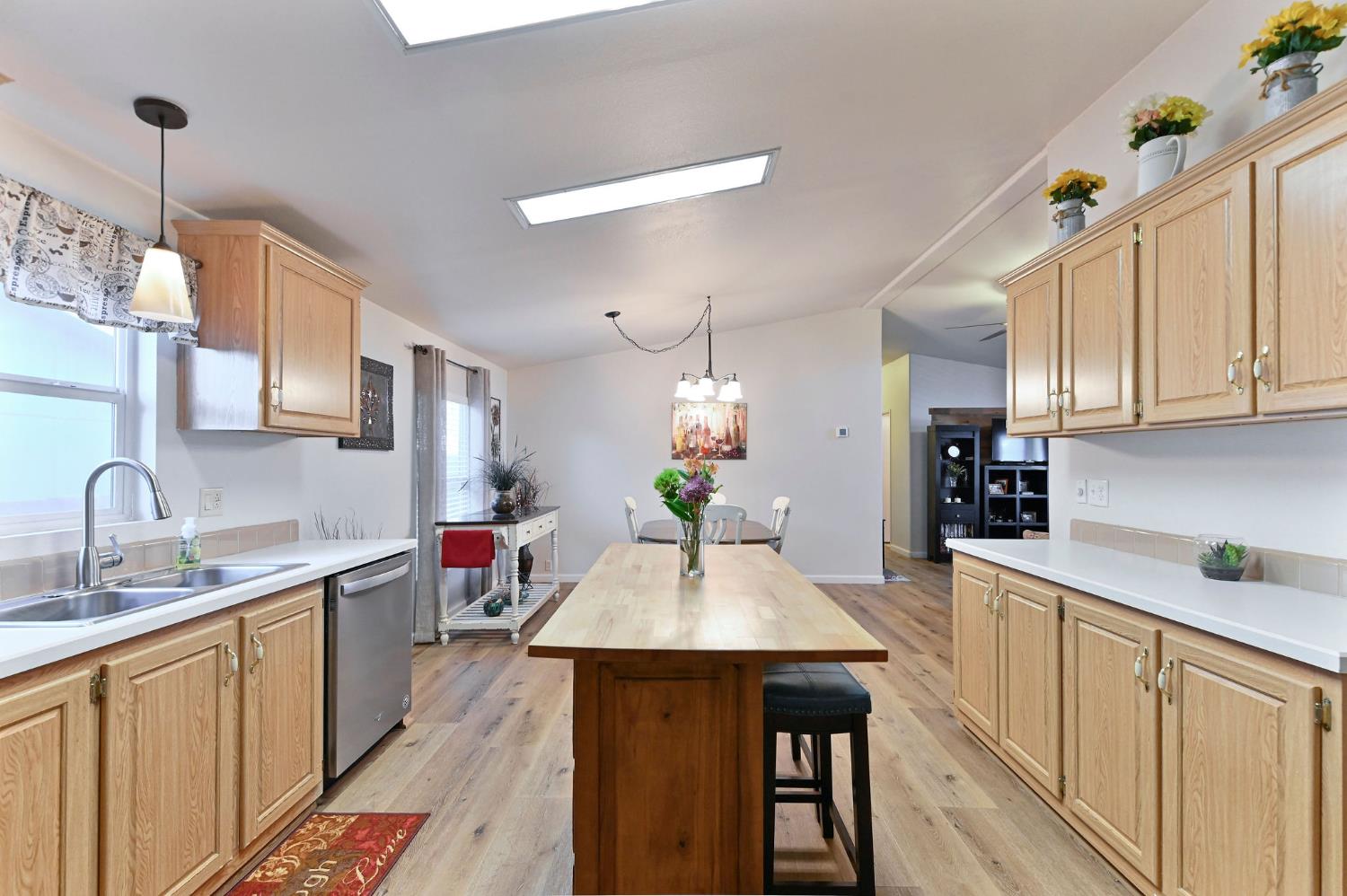 1400 West Marlette Street, Unit 2 Ione, CA 95640 - Photo 24 of 79 a kitchen with a table chairs refrigerator and cabinets