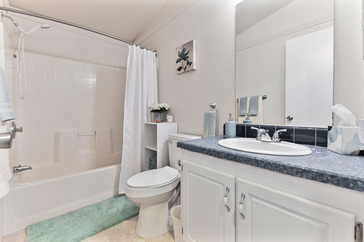 1400 West Marlette Street, Unit 2 Ione, CA 95640 - Photo 25 of 79 a bathroom with a granite countertop sink a toilet and shower