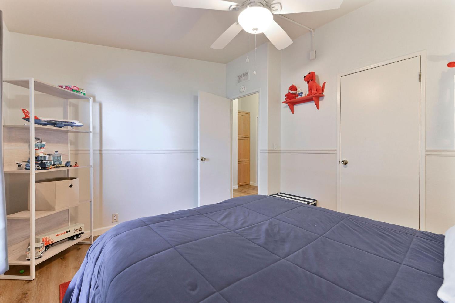 1400 West Marlette Street, Unit 2 Ione, CA 95640 - Photo 28 of 79 a bedroom with a bed and a chandelier