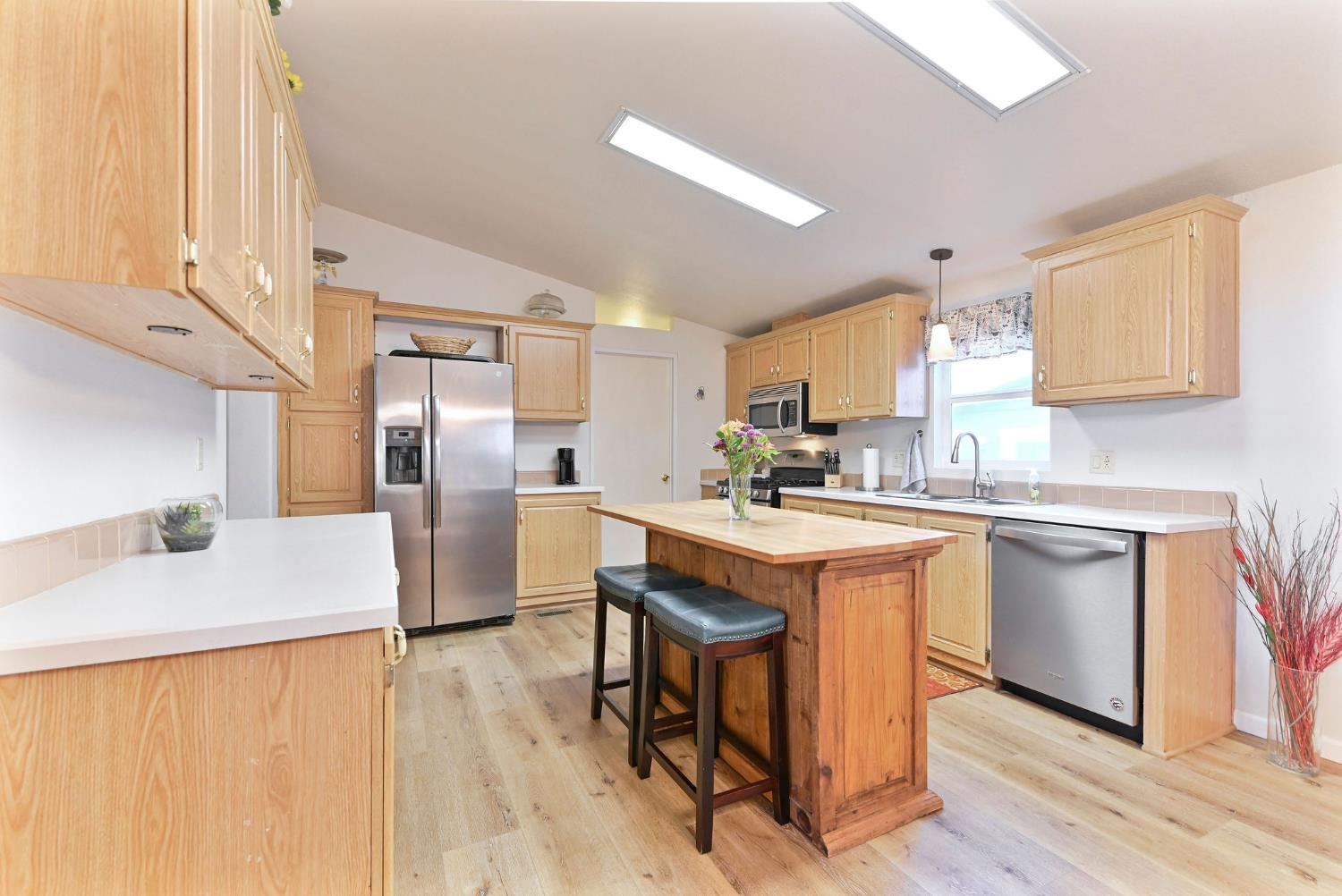 1400 West Marlette Street, Unit 2 Ione, CA 95640 - Photo 3 of 79 a kitchen with stainless steel appliances granite countertop a sink a stove a refrigerator and island with wooden floor