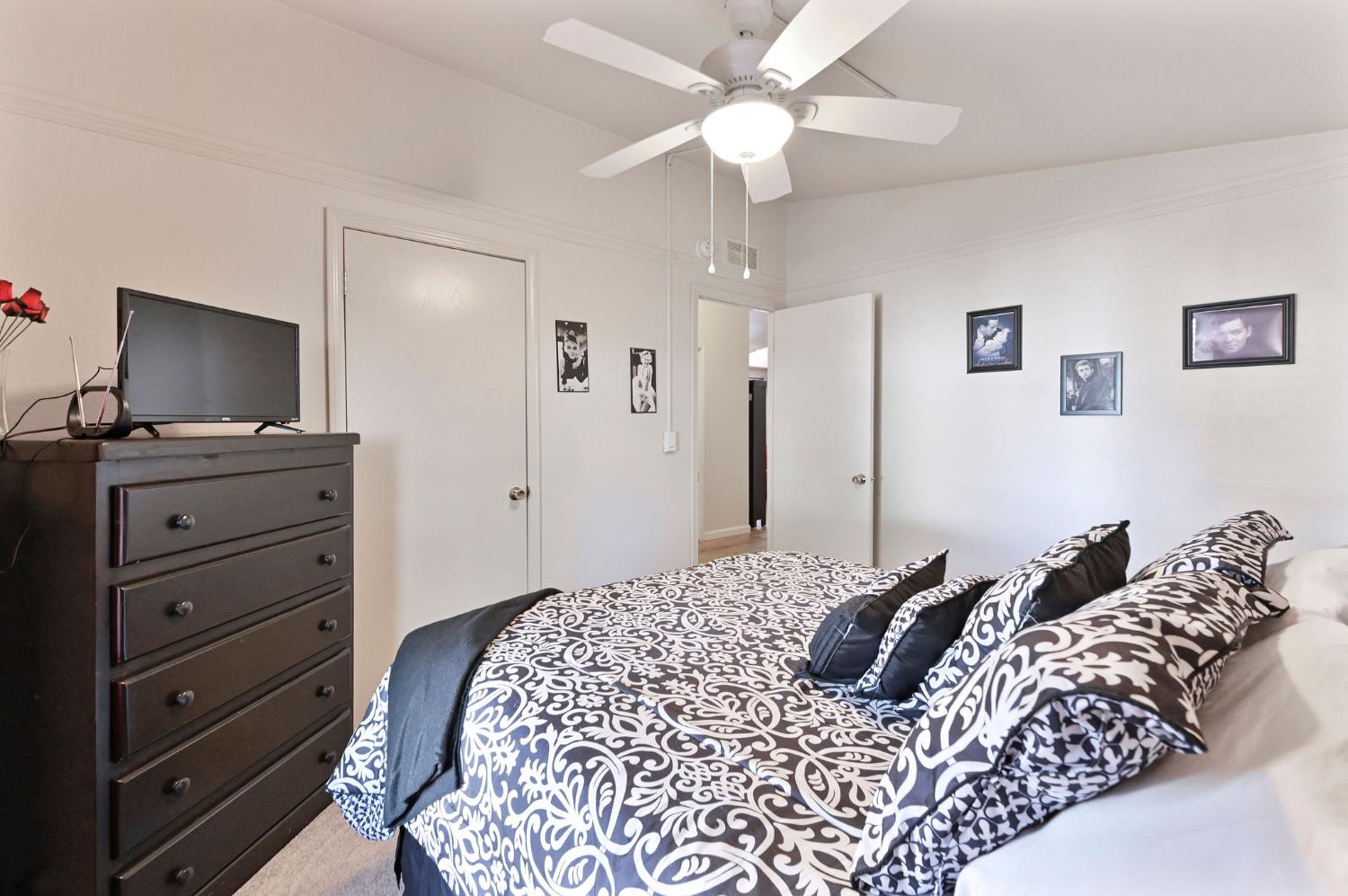 1400 West Marlette Street, Unit 2 Ione, CA 95640 - Photo 32 of 79 a bedroom with a bed and a flat tv screen on dresser