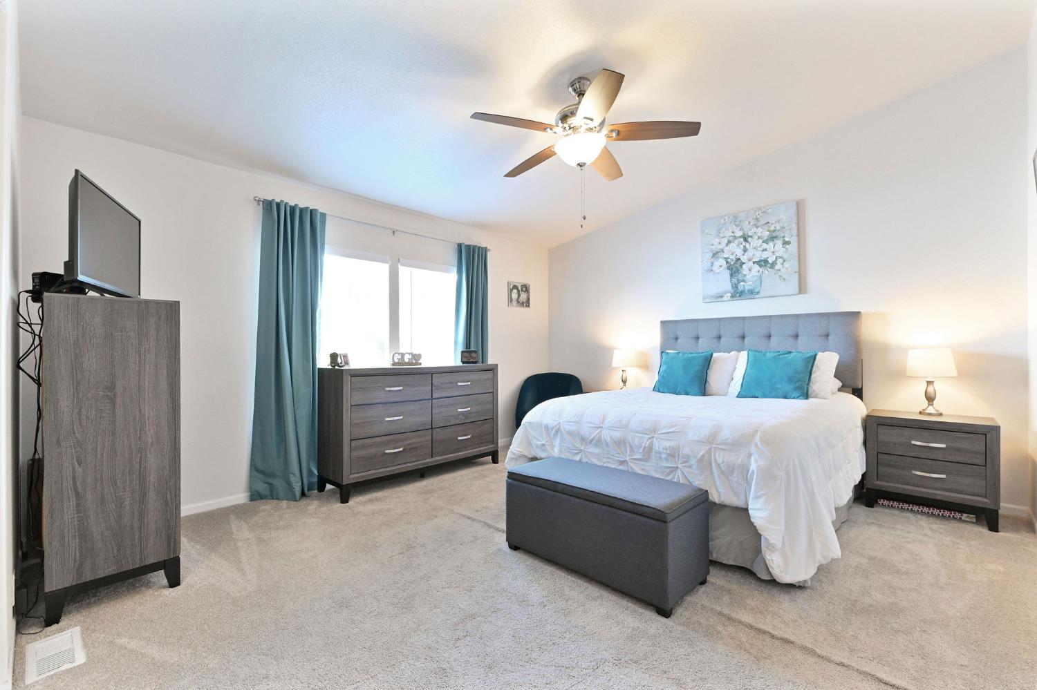 1400 West Marlette Street, Unit 2 Ione, CA 95640 - Photo 33 of 79 a bedroom with a bed and a chandelier