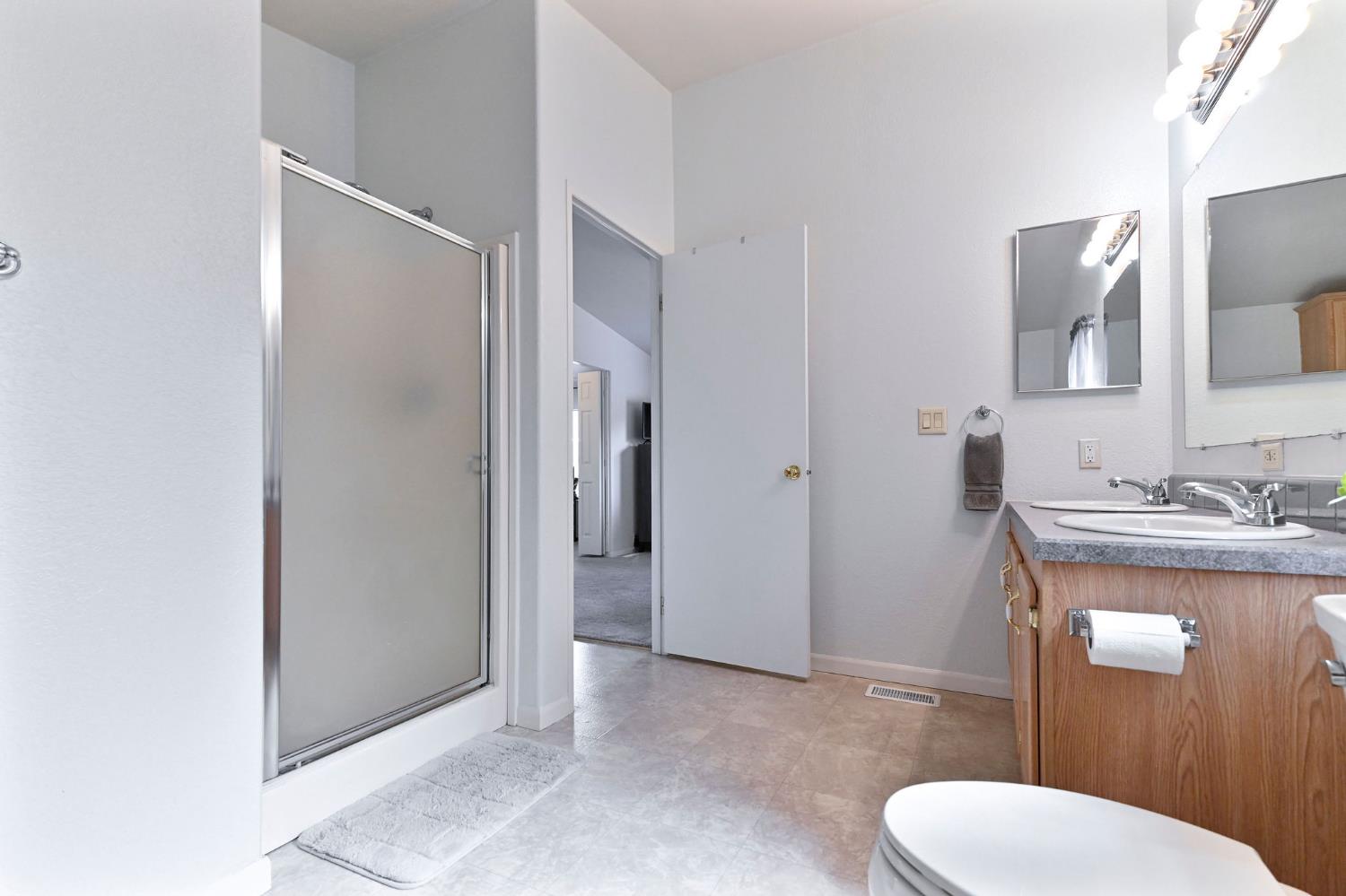 1400 West Marlette Street, Unit 2 Ione, CA 95640 - Photo 40 of 79 a bathroom with a toilet a sink and mirror
