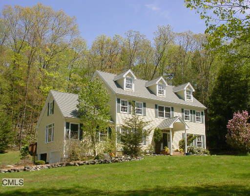 1 Valley Field Road South Newtown, CT 06482 - Photo 1 of 1 a front view of a house with a garden