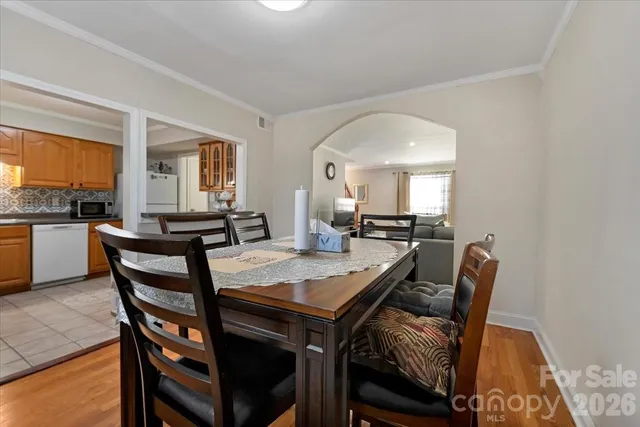 a view of a dining room with furniture and a large window
