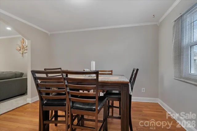 a view of a dining room with furniture and window