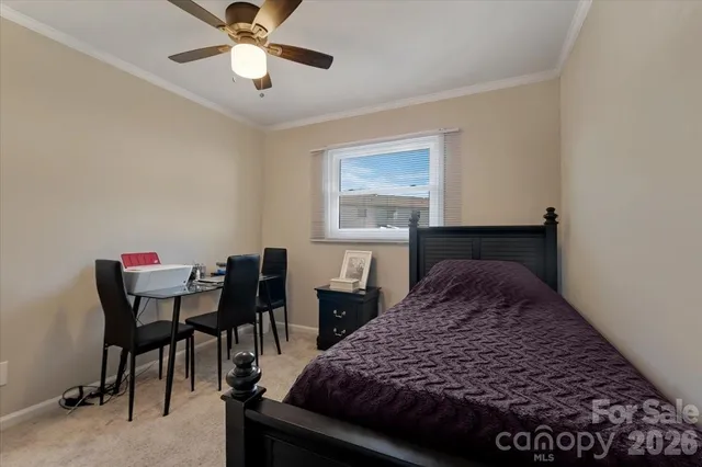 a bedroom with a bed and a table